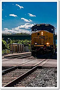 A CSX Train Approaching A Road Crossing in Brunswick, Maryland. Paper Print Wall Art (24in. x 16in.)